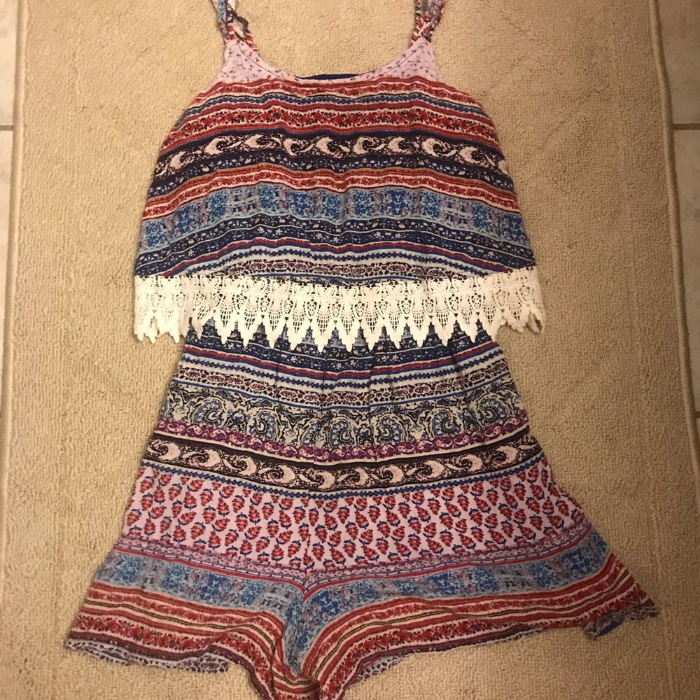 Super cute Romper blue/red with lace.